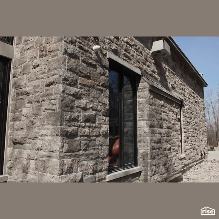 Side View of House with Stone Siding with Stone Siding by Masonal Stone Inc