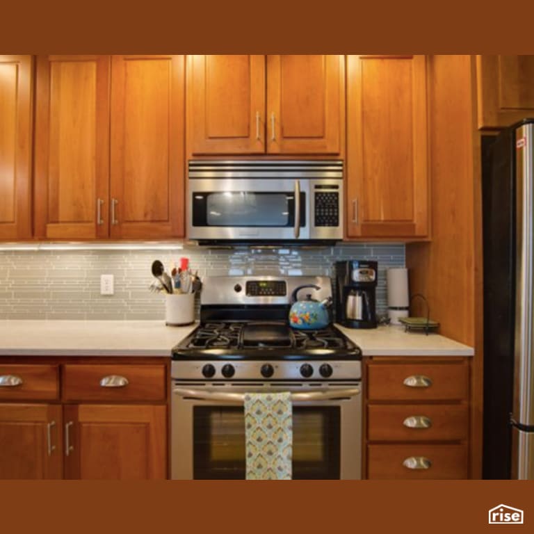 Kitchen with Gas Range by Constructive Builders