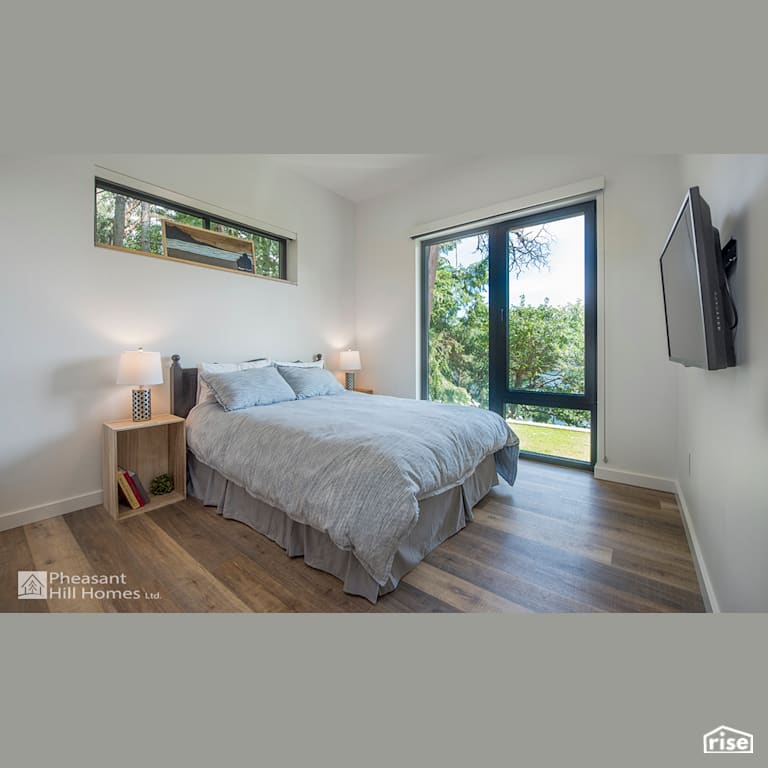 Bedroom with FSC Certified Hardwood by Pheasant Hill Homes Ltd.