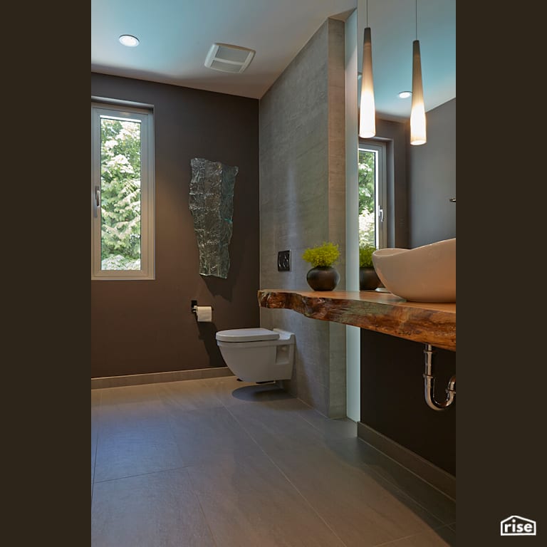Bathroom with Wall-hung Dual Flush Toilet by My House Design/Build Team Ltd.