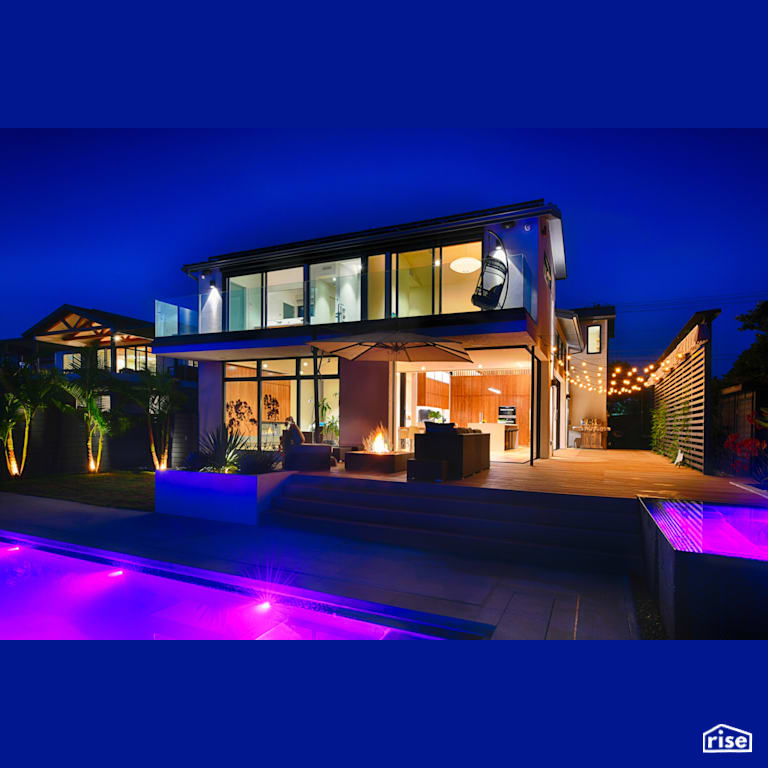 Exterior at Night with Accent Outdoor Lighting by Alliance Green Builders