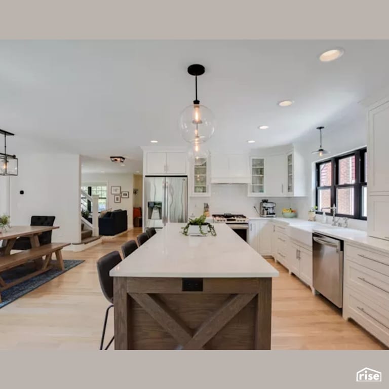 Kitchen Island with Low-Flow Kitchen Faucet by Constructive Builders