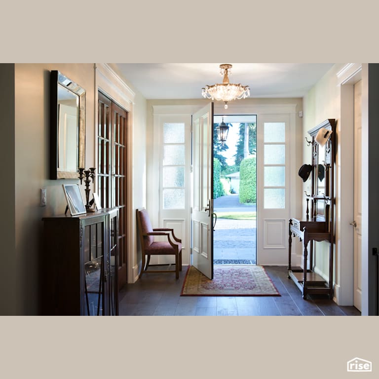 White Entryway With Wide Plank Wood Floors with Energy Star Exterior Door by Naikoon Contracting