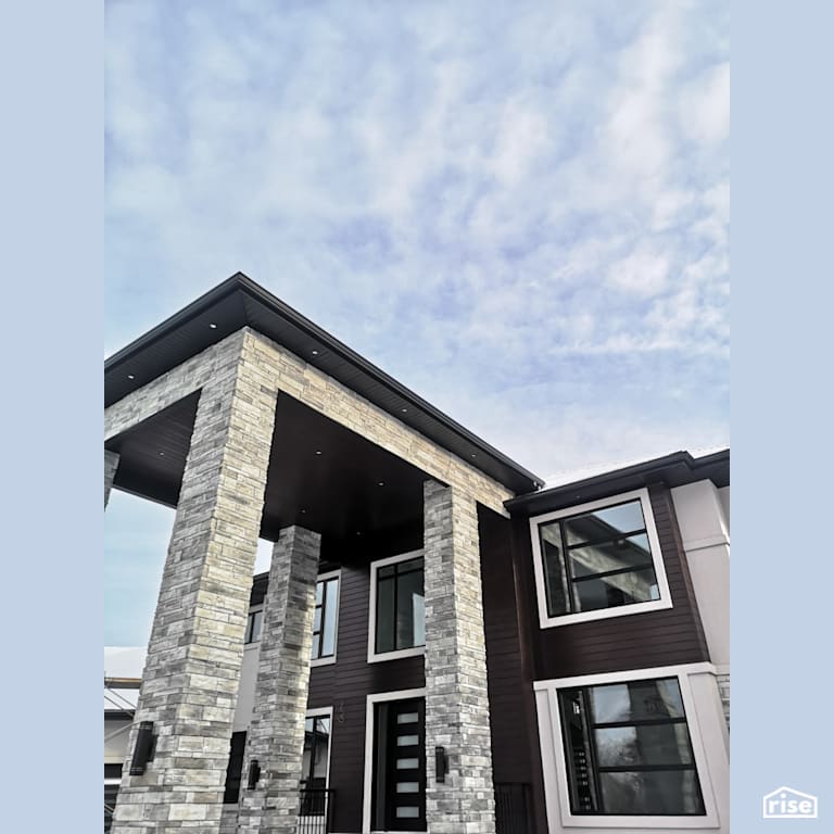 Accent outdoor lighting with brown composite siding with Composite or Engineered Siding by ChamClad by Chameleon