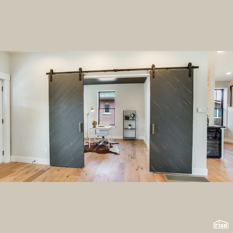Sliding bar doors into home office with Engineered Hardwood by Revolve Design Build