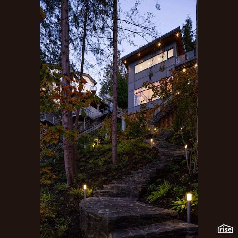 Exterior with Accent Outdoor Lighting by Naikoon Contracting