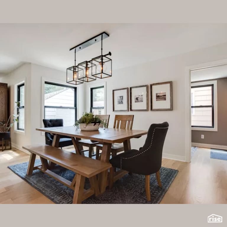 Dining Room with Laminate Flooring by Constructive Builders