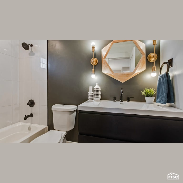 Bright bathroom with feature mirror with Low-Flow Bathroom Faucet by Revolve Design Build