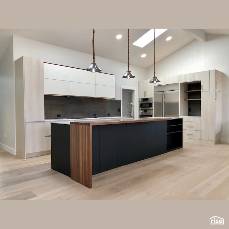Open concept kitchen with custom island rope  lighting with Low-Flow Kitchen Faucet by Revolve Design Build