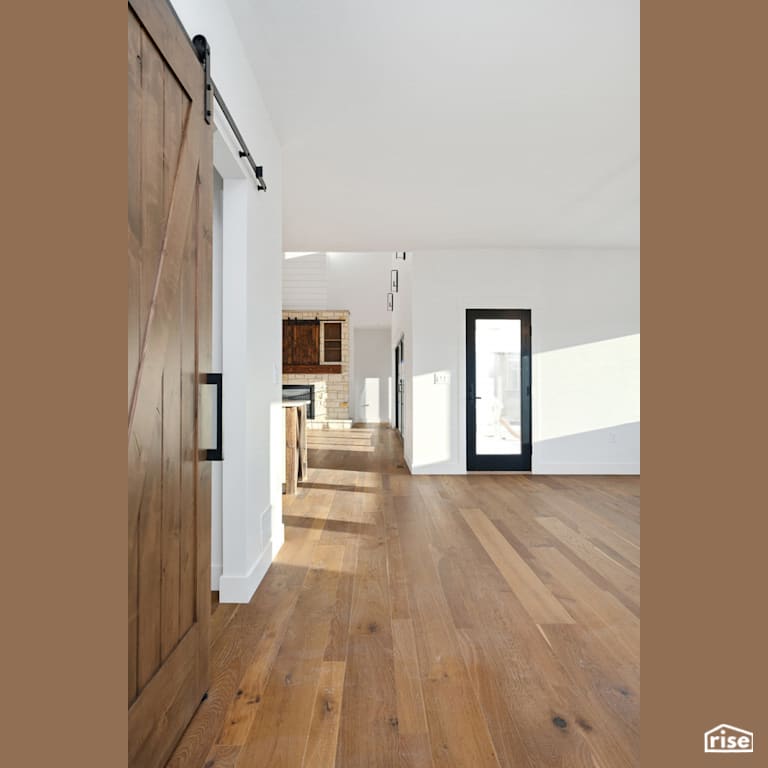Hallway leading to open concept kitchen with Engineered Hardwood by Revolve Design Build
