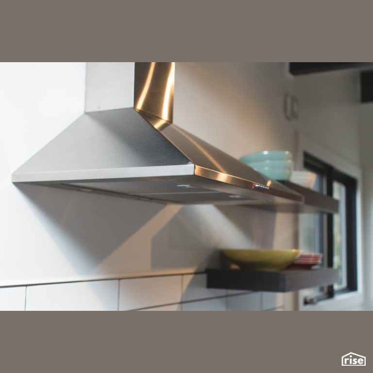 Bachelor Pad Renovation Kitchen with Range Hood by Vantage Build