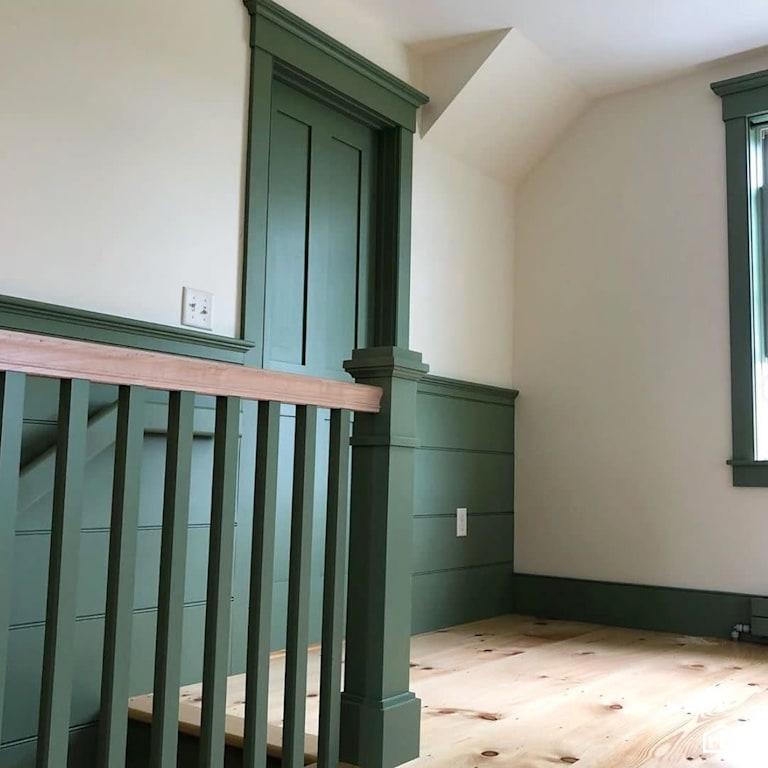 Green staircase with finished railing with Interior Wood Finish by Vermont Natural Coatings