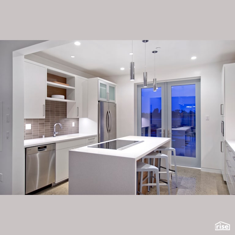 Bright white kitchen with glass tiles and stainless appliances with Induction Cooktop by Alpen High Performance Products