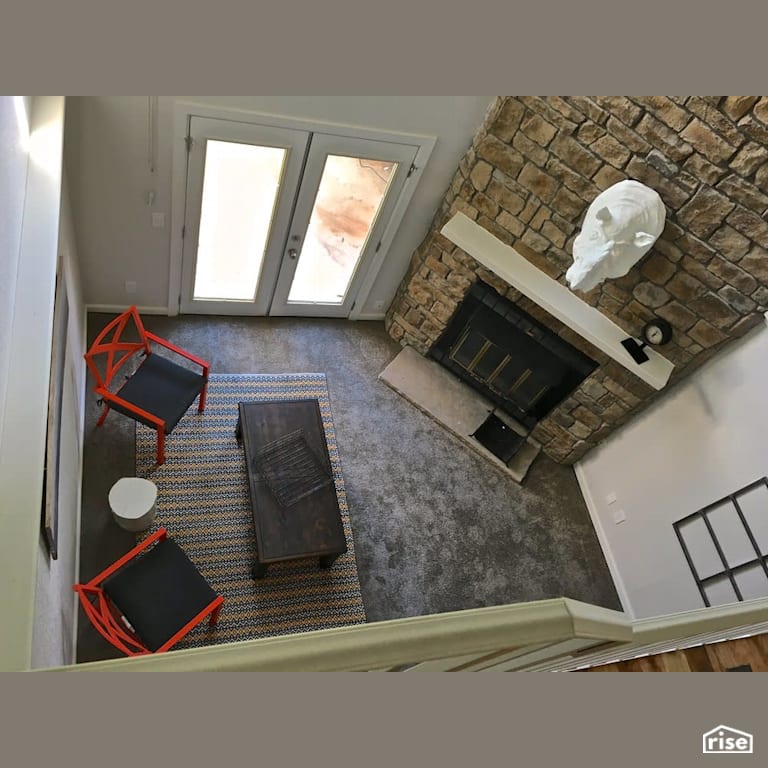 Rear entryway leading to wood fireplace with Energy Star Exterior Door by Revolve Design Build
