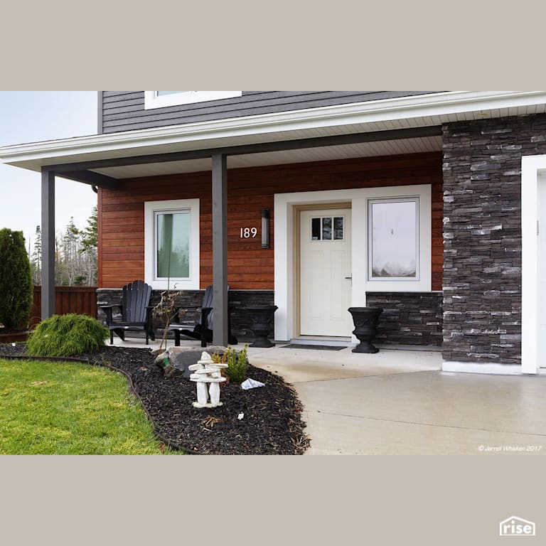 Olive Urban Retreat Exterior with Stone Veneer Siding by Passive Design Solutions