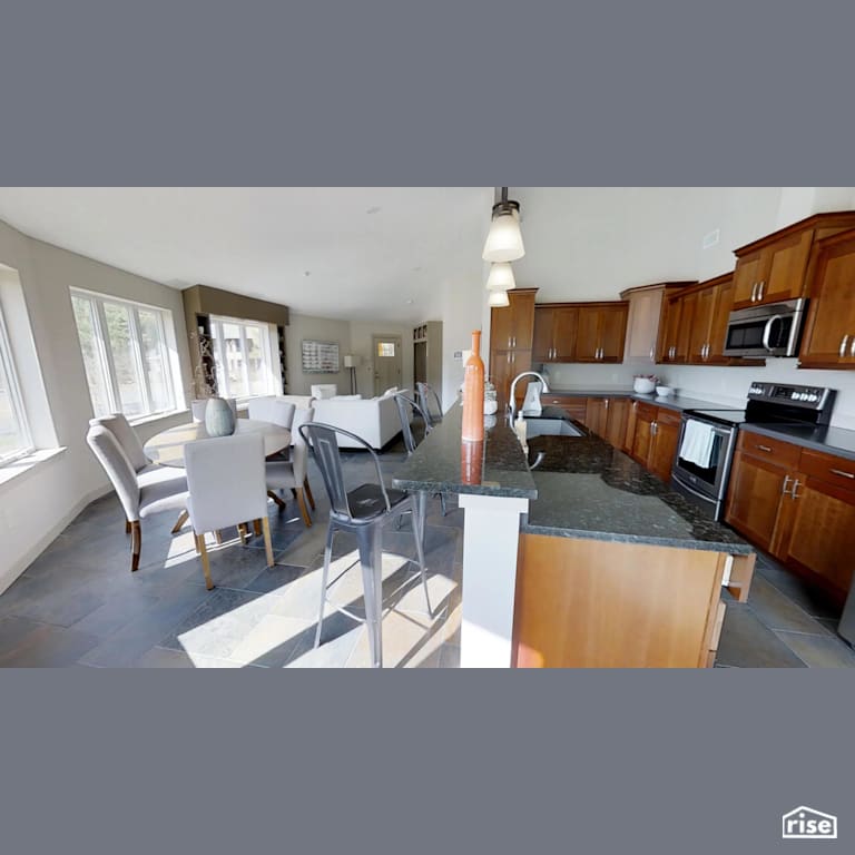 Open concept kitchen with Low-Flow Kitchen Faucet by Deltec Homes