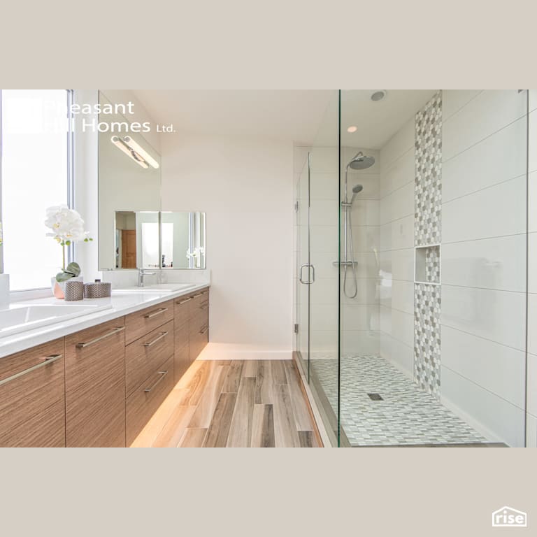 Beachfront Living - Bathroom with Low-Flow Showerhead by Pheasant Hill Homes Ltd.