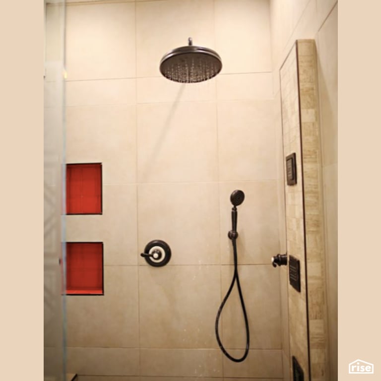Bathroom with Low-Flow Showerhead by Constructive Builders