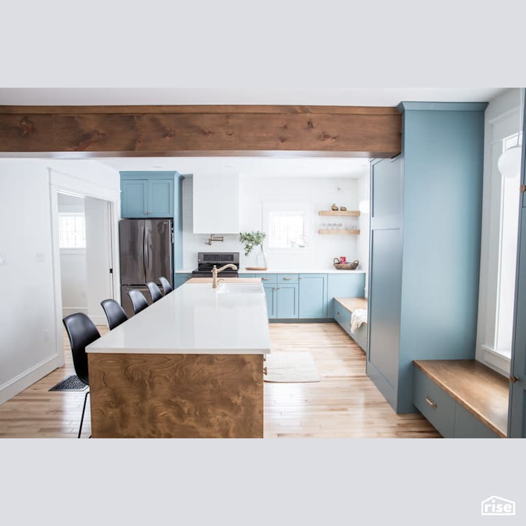 Open kitchen with exposed wood beam with Engineered Hardwood by Reimagine Designs