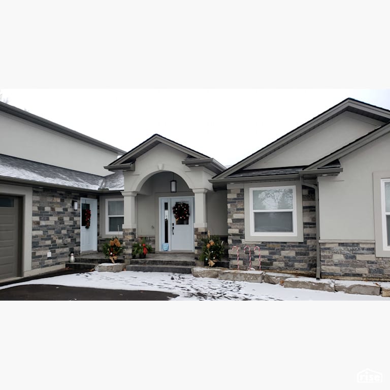 Front Side - Stone Siding with Stucco by Masonal Stone Inc