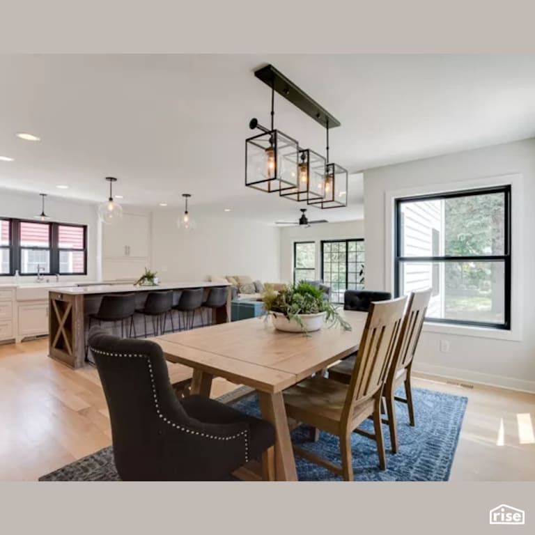 Dining Room with Low-Flow Kitchen Faucet by Constructive Builders