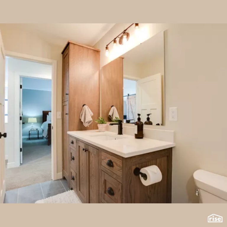 Bathroom with FSC Certified Wood Cabinet by Constructive Builders