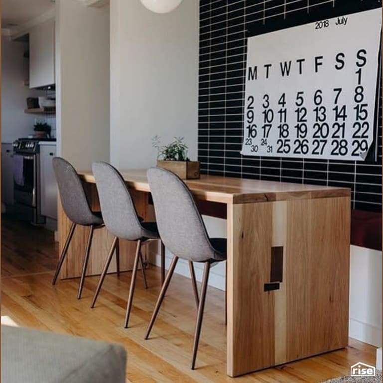 Finished wood dining table facing wall with Interior Wood Finish by Vermont Natural Coatings