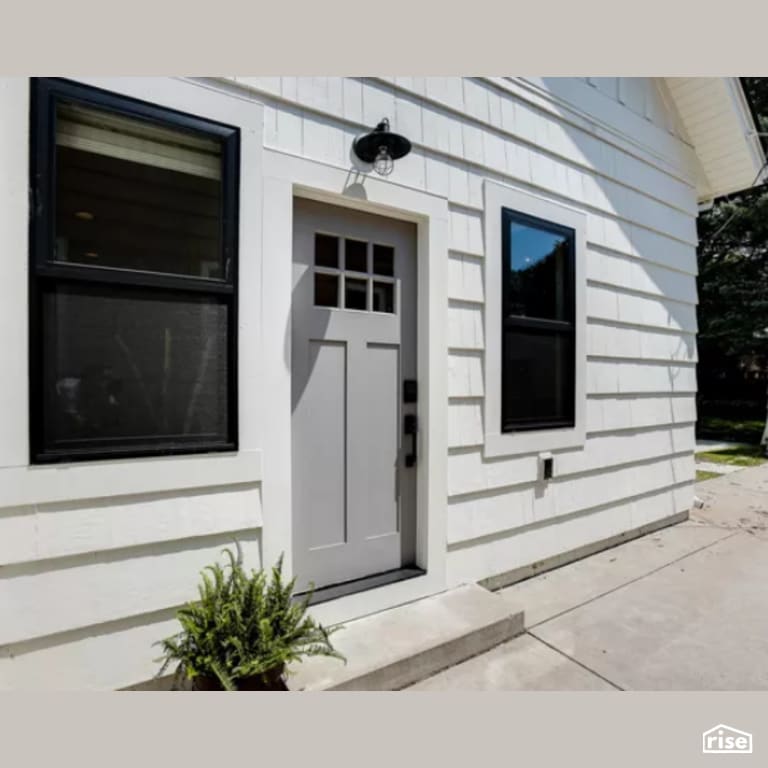 Exterior with Solid Wood Door by Constructive Builders