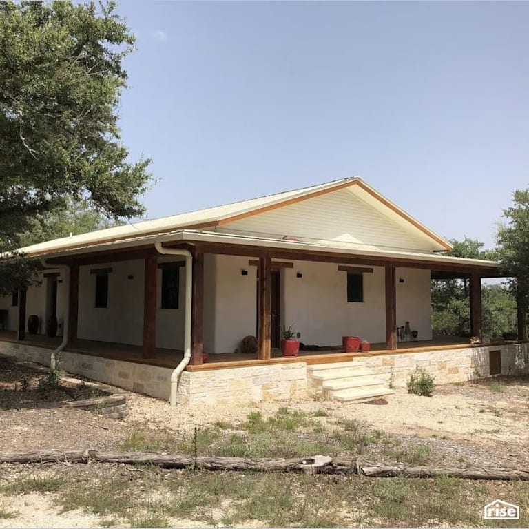 Exterior of Texas compressed earth block home with Accent Outdoor Lighting by TexaTerra Block