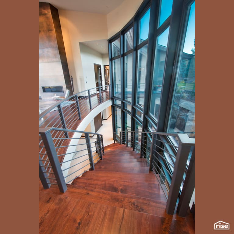 Window-lined staircase with hardwoord floors and industrial metal railing with Integrated LED by Alpen High Performance Products