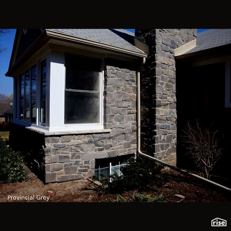 Stone sided single level home with Stone Siding by Masonal Stone Inc