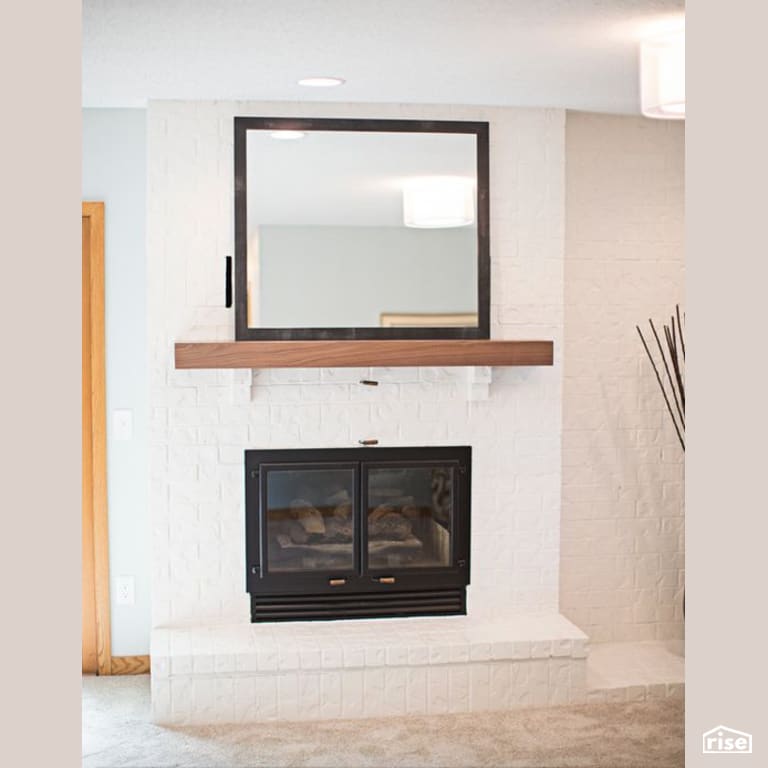 Living Room Fireplace with Integrated LED by Constructive Builders