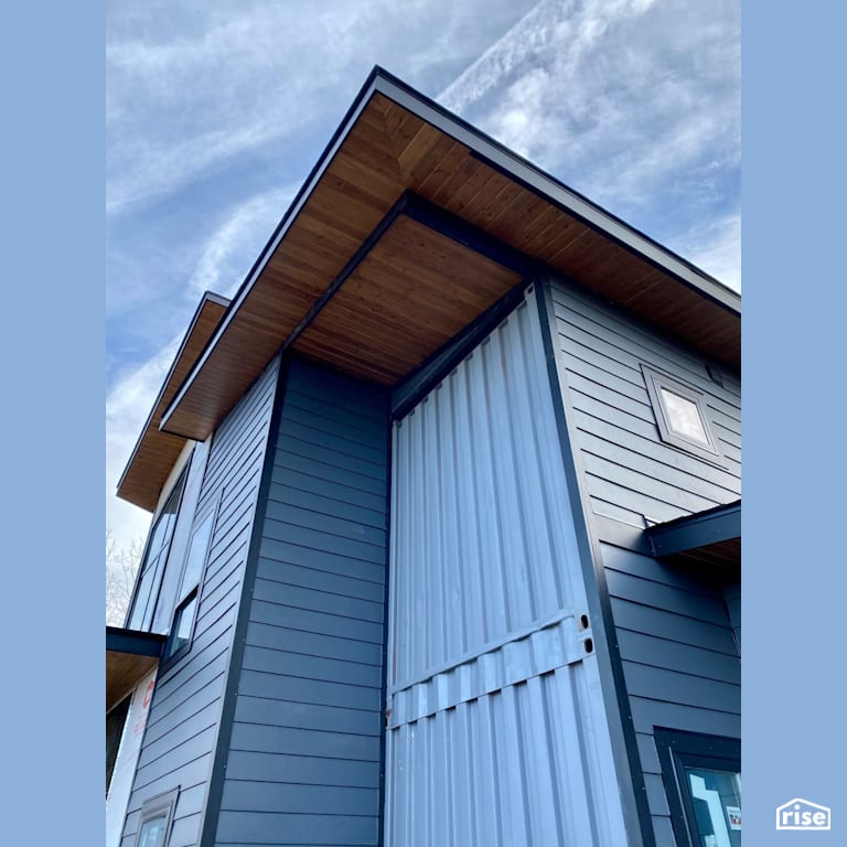 Shiplap Exterior Accent on The Ebeling House with Shiplap Wood Siding by Three Squared Inc.