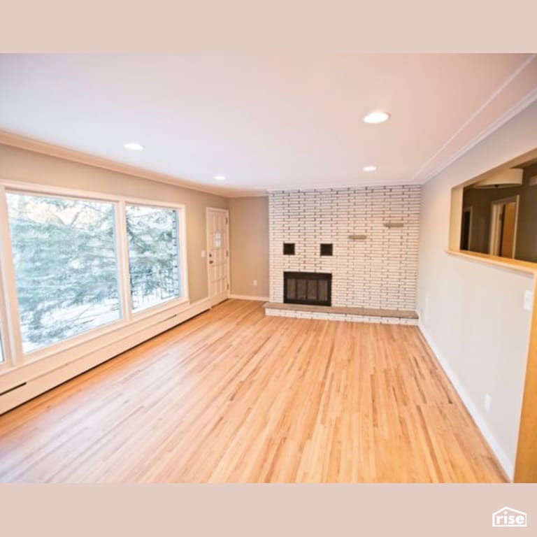 Living Room with FSC Certified Hardwood by Constructive Builders