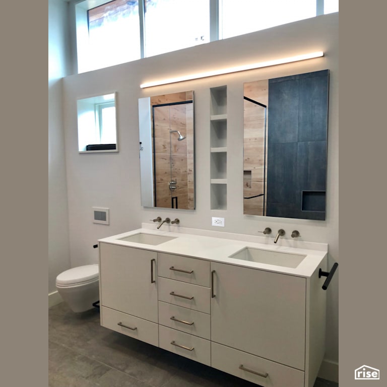 Dual vanity bathroom with natural lighting with Low-Flow Bathroom Faucet by Revolve Design Build
