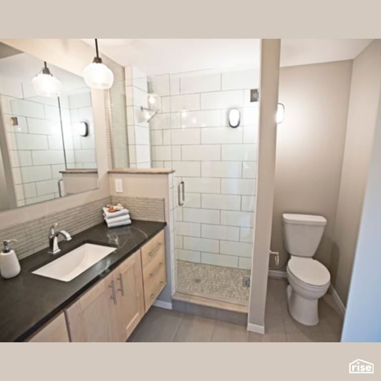 Bathroom with Dual Flush Toilet by Constructive Builders