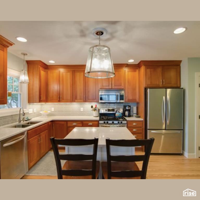 Kitchen with Gas Range by Constructive Builders