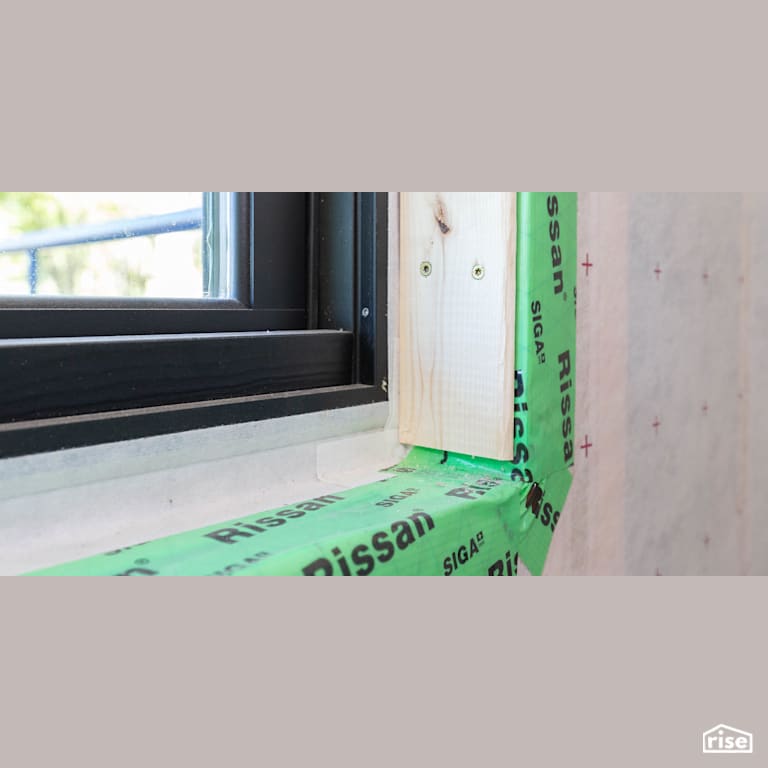 SIGA Rissan taped window frame with Vapor Control Layer by SIGA North America