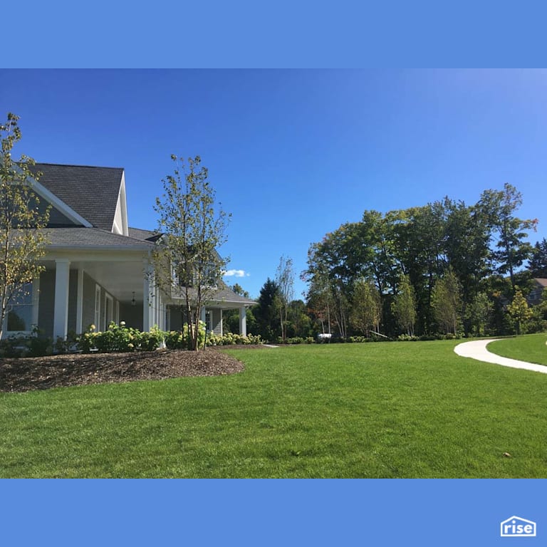 Front Exterior Landscaping with Wood Mulch by Earthworks Landscape & Design