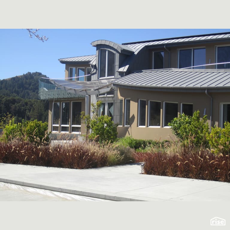 Entry court of beautiful window-filled custom home with Fixed Window by Alpen High Performance Products