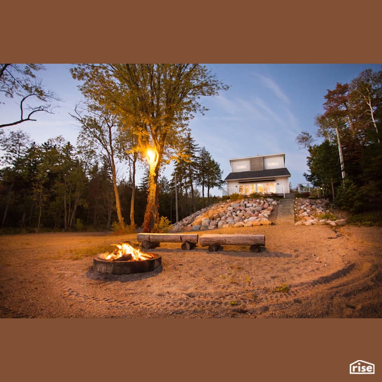 Lofty Cottage On The River Exterior with Accent Outdoor Lighting by Vantage Build