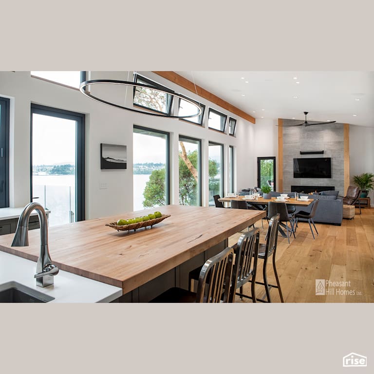Kitchen with Salvaged Wood Countertop by Pheasant Hill Homes Ltd.