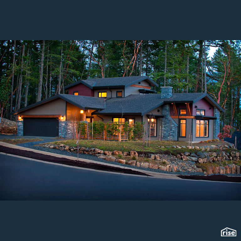 Efficient Living at the Ridge - Exterior with Accent Outdoor Lighting by Pheasant Hill Homes Ltd.