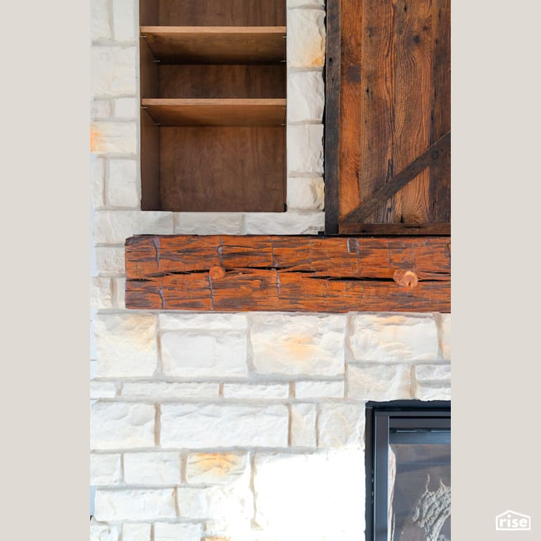 Gas fireplace with wood and stone feature wall with Reclaimed Hardwood by Revolve Design Build