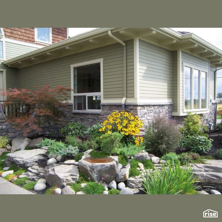 Exterior Landscaping with Stone Siding by Winsome Construction