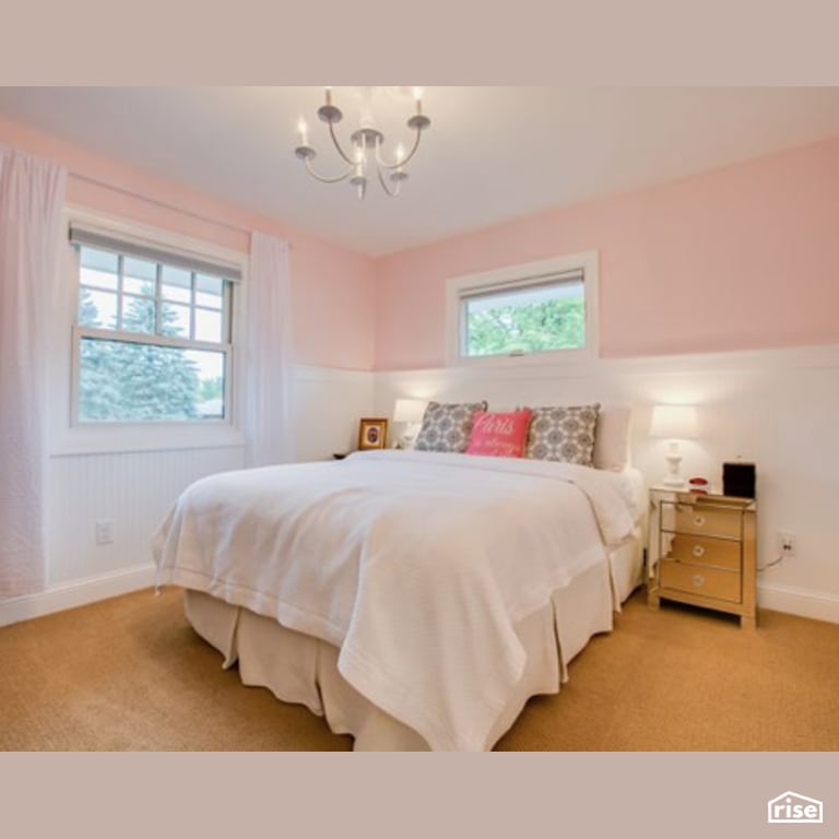 Pink Bedroom with Ceiling Light by Constructive Builders