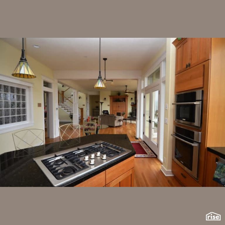 Kitchen with Gas Range by Winsome Construction