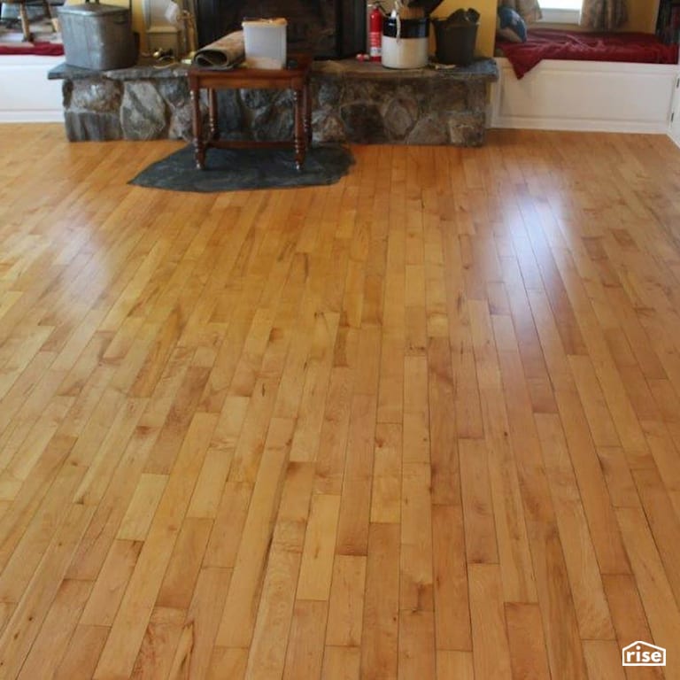 Finished wood floor around fireplace with Interior Wood Finish by Vermont Natural Coatings
