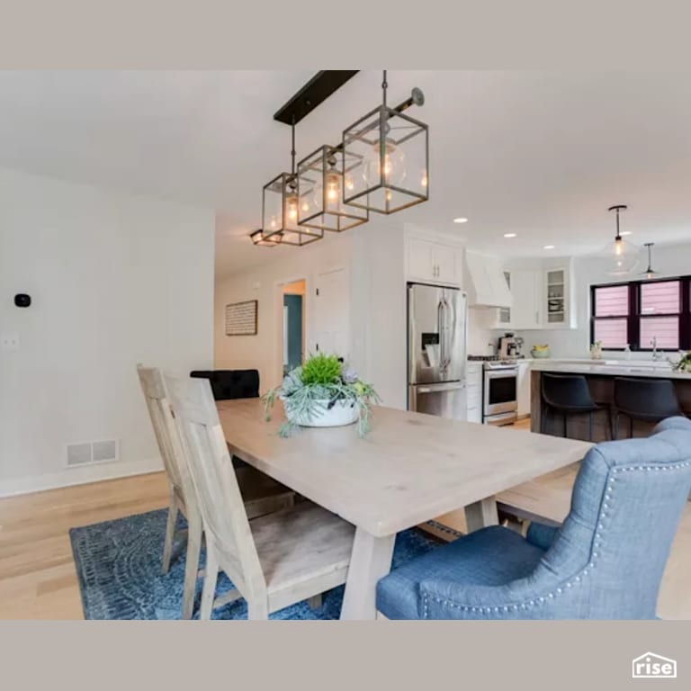 Dining Room with Laminate Flooring by Constructive Builders