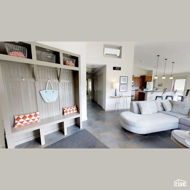 Entryway to open concept kitchen and living room with Ceramic Tile Floors by Deltec Homes